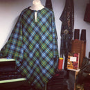 Tartan Poncho - Reiver from The Kiltmakery displayed elegantly on a mannequin, showcasing its stylish design and high-quality lightweight fabric.