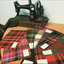 Heavy Weight Swatches from The Kiltmakery showcasing vibrant tartan patterns and material texture for kilt customization.