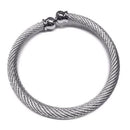Celtic Stainless Steel Torque Bangle displayed in an elegant black presentation box, showcasing its unique Celtic design and adjustable fit.