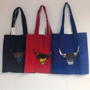 Highland Cow Tote Bag in Scotland 2000 Tartan displayed outdoors, highlighting its eco-friendly features and spacious design.